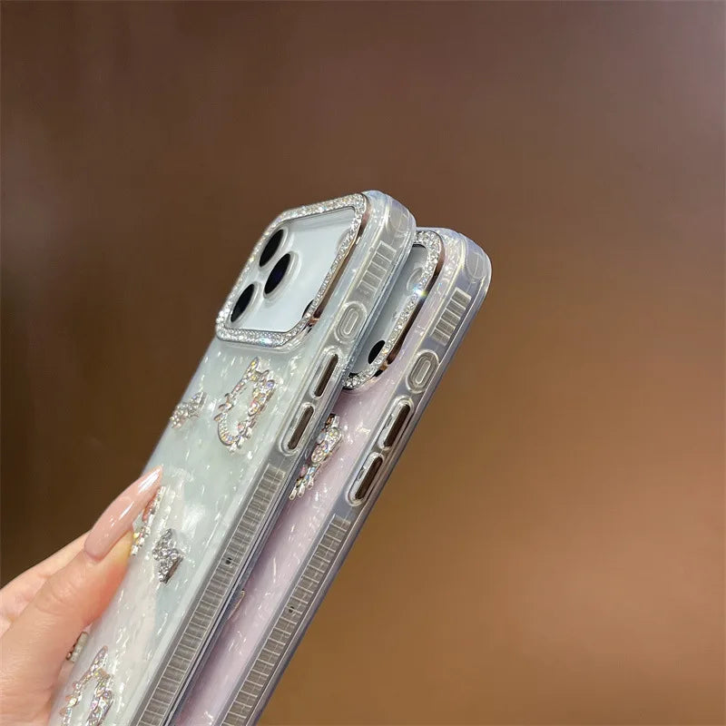 Luxury Glitter Rhinestone Camera Border 3D Hello Kitty Bowknot Shell Pattern Phone Case For iPhone 16 15 14 13 17 Pro Max Cover